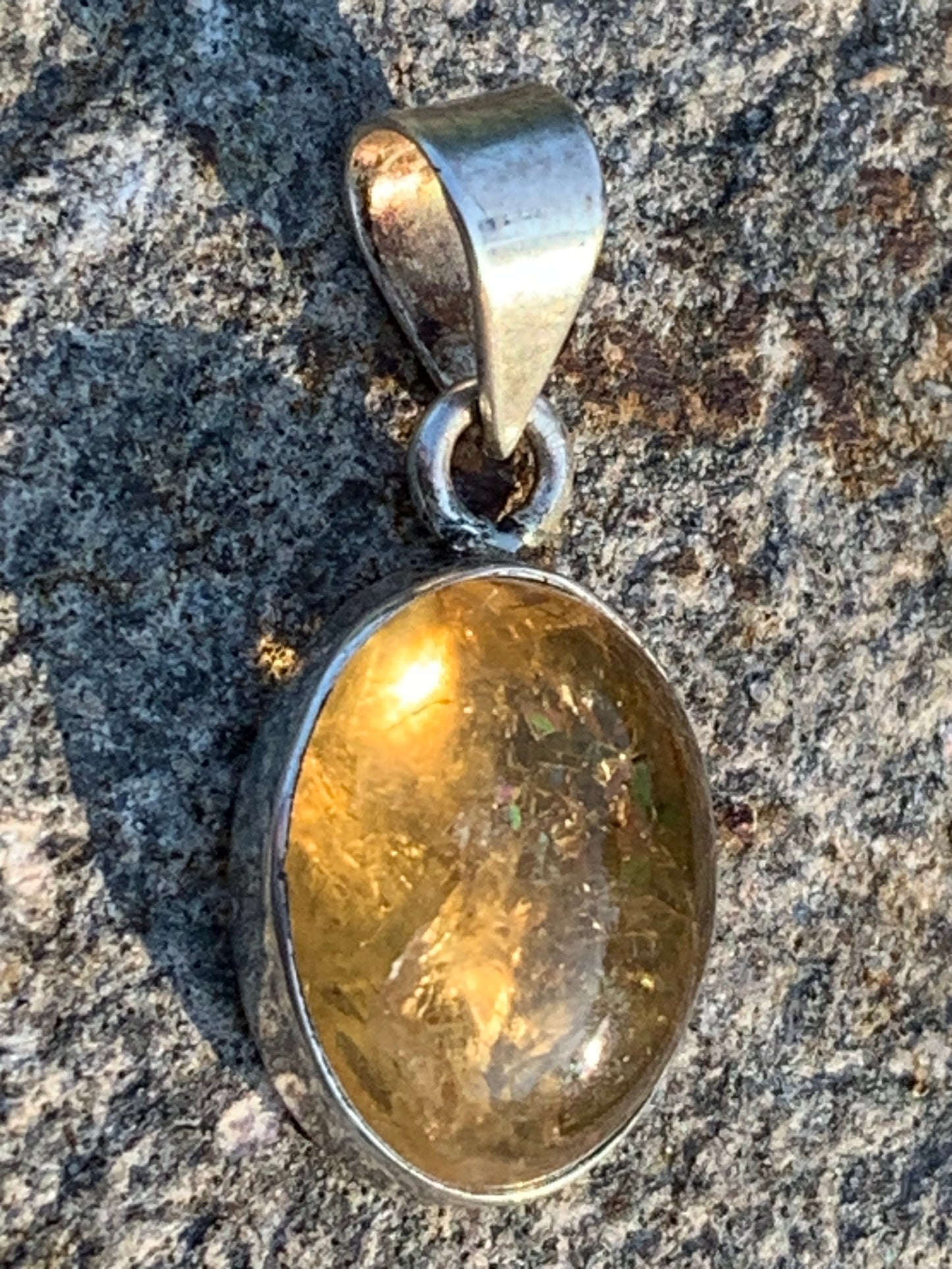 Citrine, silver medallion 30mm high x 14 x 8. Sold with adjustable cord, ready to wear!
