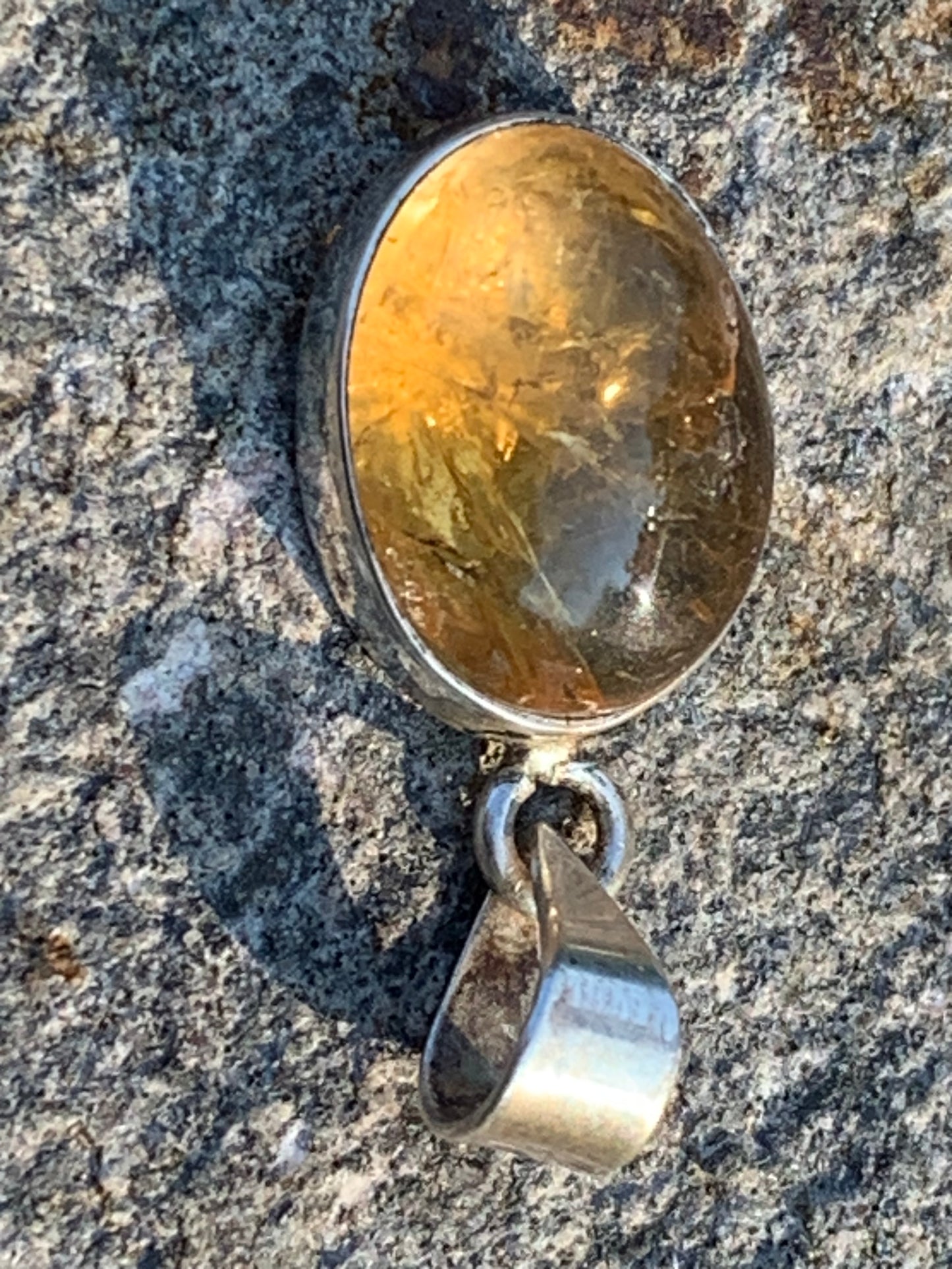 Citrine, silver medallion 30mm high x 14 x 8. Sold with adjustable cord, ready to wear!