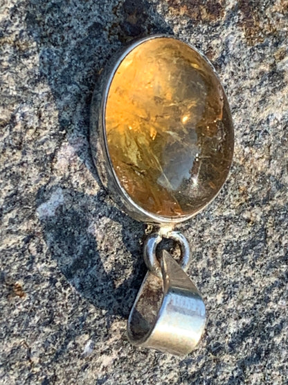 Citrine, silver medallion 30mm high x 14 x 8. Sold with adjustable cord, ready to wear!