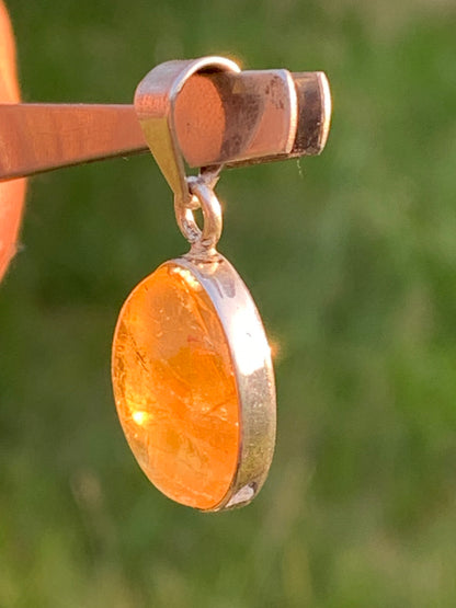 Citrine, silver medallion 30mm high x 14 x 8. Sold with adjustable cord, ready to wear!