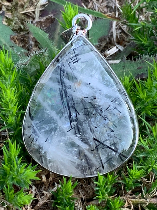 Rock crystal/quartz with black tourmaline inclusions! Silver pendant, 48mm high x30 x7. Sold with adjustable black cord!