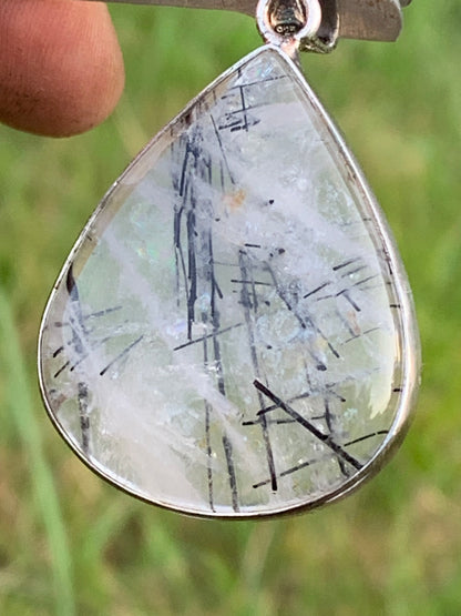 Rock crystal/quartz with black tourmaline inclusions! Silver pendant, 48mm high x30 x7. Sold with adjustable black cord!
