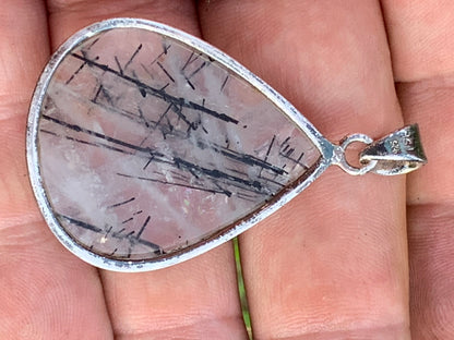Rock crystal/quartz with black tourmaline inclusions! Silver pendant, 48mm high x30 x7. Sold with adjustable black cord!