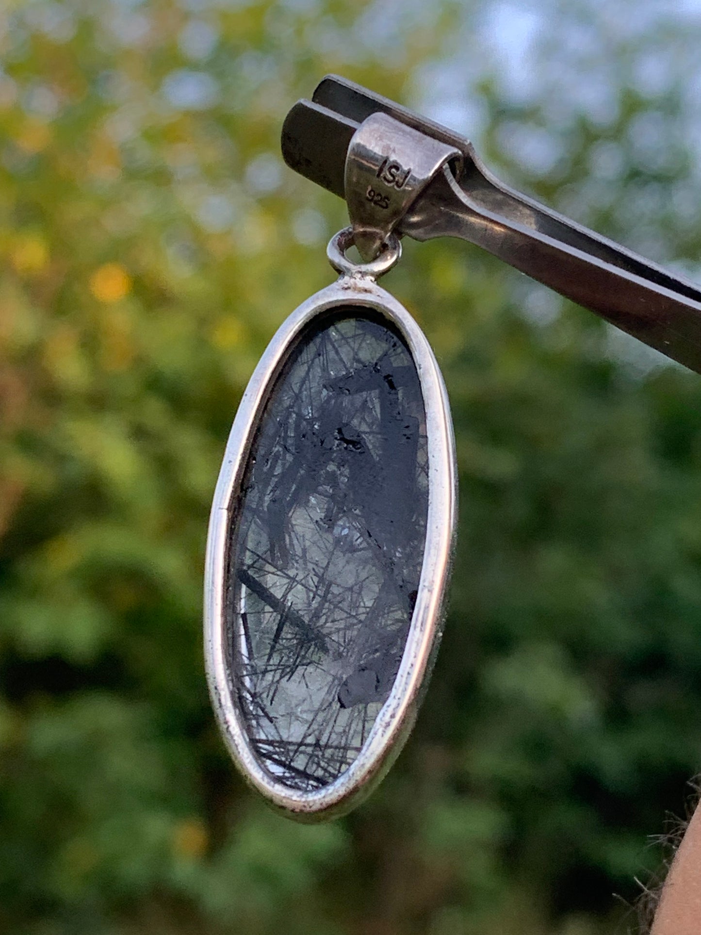 Rock crystal/quartz with black tourmaline inclusions! Silver pendant, 45mm high x15 x8. Sold with adjustable black cord!