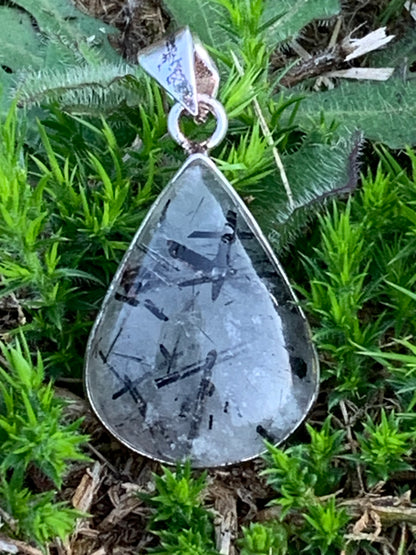 Rock crystal/quartz with black tourmaline inclusions! Silver pendant, 38mm high x21 x7. Sold with adjustable black cord!