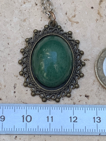 Bronze-colored medallion with Aventurine/green quartz, 36 mm high x 30 x 3. Sold with an adjustable black cord!