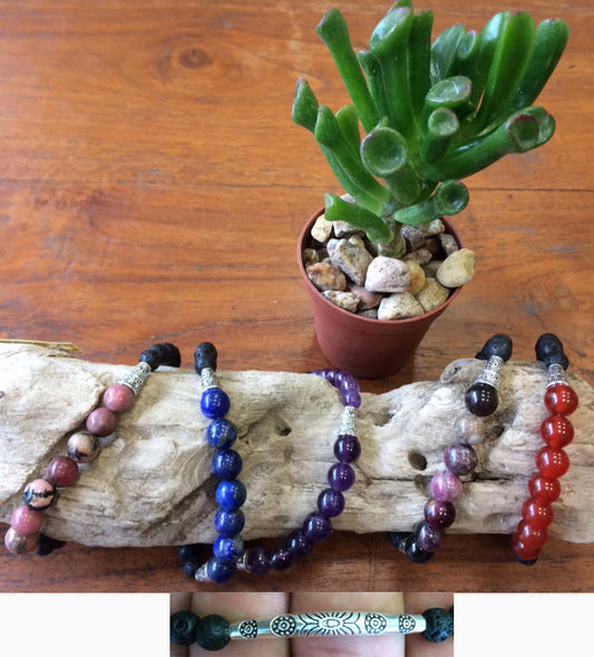 Ethnic bracelet collection... Made of 8mm lava beads and 7 semi-precious stone beads. Available in lengths from 17 to 21 centimeters. Handmade by Gem &amp; Zen!