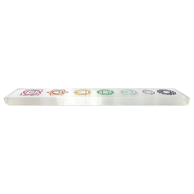 Rectangular selenite plate with a 7 chakra motif. Perfect for purifying and charging minerals, jewelry, etc.