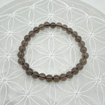 Cristal de roche fumé/ Quartz Fumé, perles rondes de 6 ou 8 mm. Vendu en fil de perle 38/39 cm, en bracelet de 17 à 21cm, en collier de 45 ou sautoir de 60cm. Qualité AA à AAA !