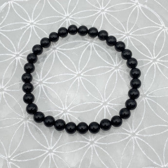 Tourmaline noire, perles rondes de 4, 6, 8 ou 10 mm. Vendu en fil de perle 38/39 cm, en bracelet de 17 à 21cm, en collier de 45 ou sautoir de 60cm. Qualité AA à AAA !