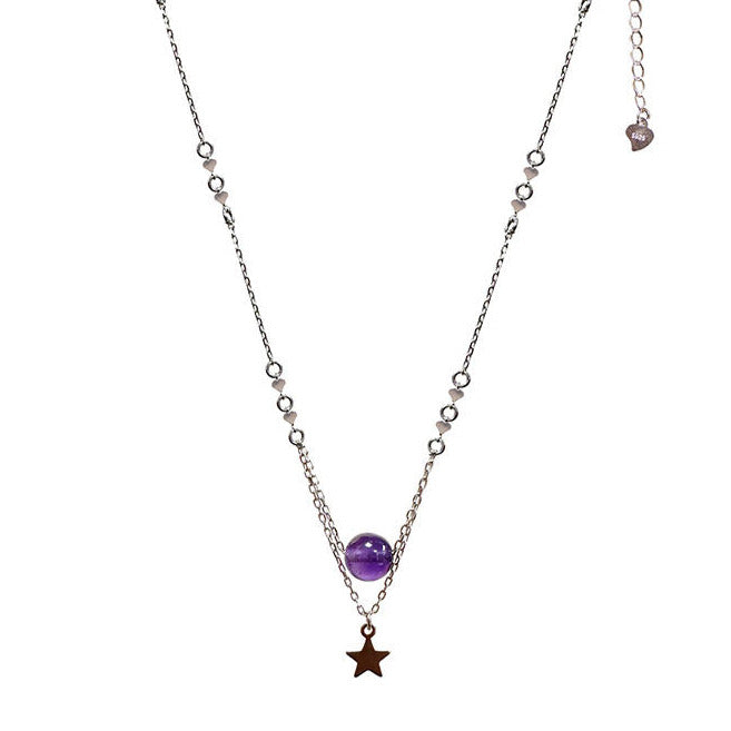 0.925 silver necklace, 40 cm long, accompanied by a delicate 5 cm chain. This jewel is adorned with an elegant 8 mm amethyst pearl as well as a star. Length: 40 cm Pearl diameter: 8 mm Packaging: The piece