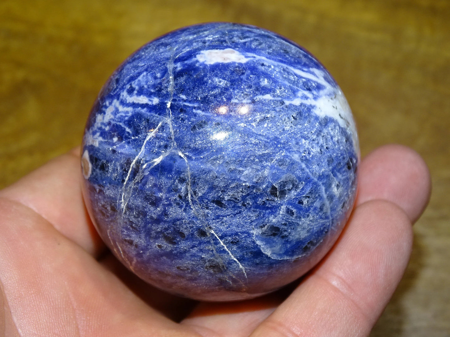 Sodalite sphere weighing 320 grams and measuring 58 millimeters. Perfect for a collection or exhibition!