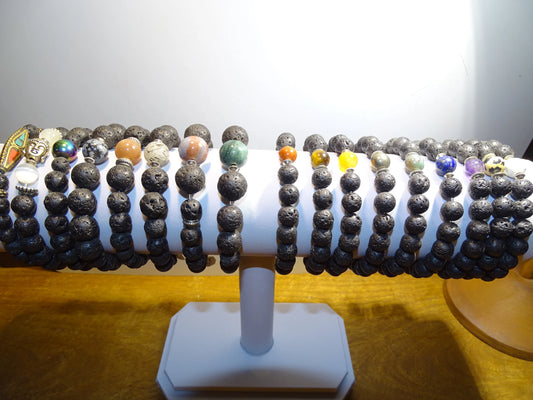 Lava Stone Bracelet Collection... Made from 8mm lava beads and a semi-precious stone bead. Available in lengths from 17 to 21 centimeters. Handmade by Gem &amp; Zen!