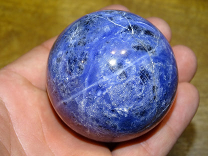 Sodalite sphere weighing 320 grams and measuring 58 millimeters. Perfect for a collection or exhibition!