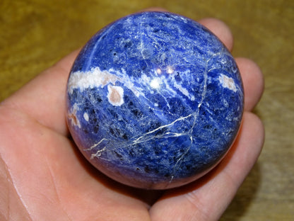 Sodalite sphere weighing 320 grams and measuring 58 millimeters. Perfect for a collection or exhibition!