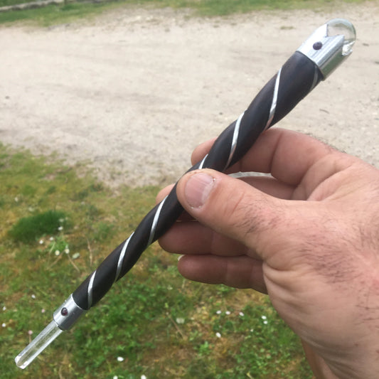 A 'magic' wand, a highly valued instrument for energy healing. Each healing wand is crafted from rosewood with a rock crystal tip and ball.