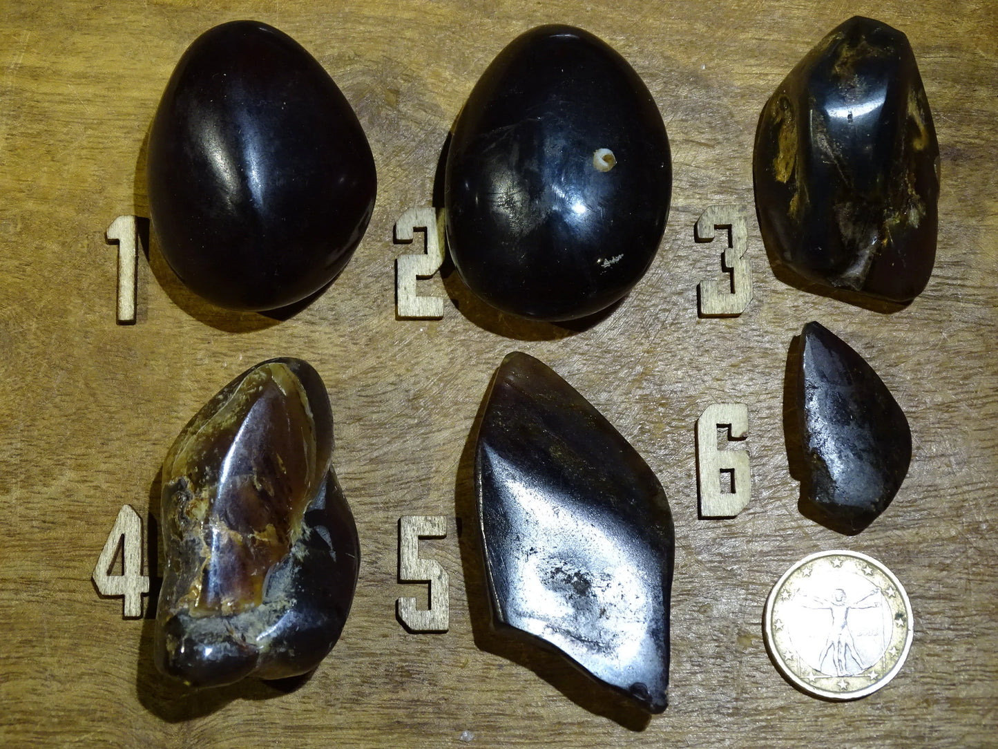 Sumatran blue amber, a selection of polished pebbles, 'cherry/cognac amber' color. Very high quality, when transparent you will see incredible amber red reflections and a captivating blue under a UV lamp!