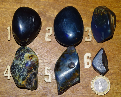 Sumatran blue amber, a selection of polished pebbles, 'cherry/cognac amber' color. Very high quality, when transparent you will see incredible amber red reflections and a captivating blue under a UV lamp!