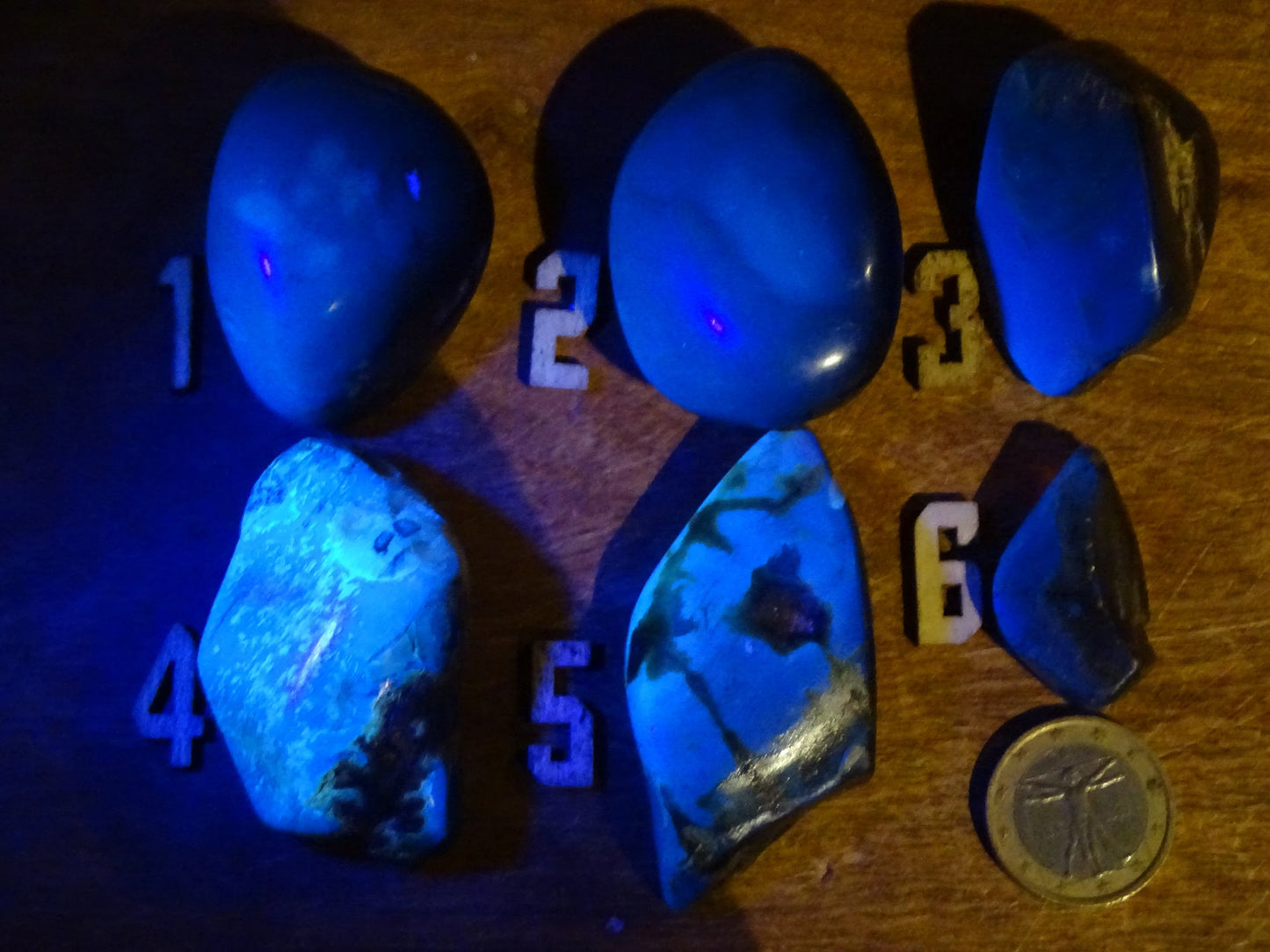 Sumatran blue amber, a selection of polished pebbles, 'cherry/cognac amber' color. Very high quality, when transparent you will see incredible amber red reflections and a captivating blue under a UV lamp!