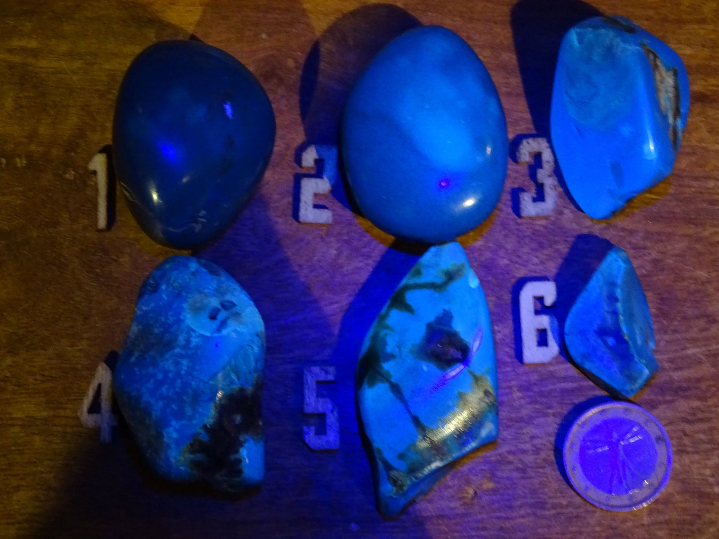 Sumatran blue amber, a selection of polished pebbles, 'cherry/cognac amber' color. Very high quality, when transparent you will see incredible amber red reflections and a captivating blue under a UV lamp!