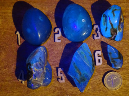 Sumatran blue amber, a selection of polished pebbles, 'cherry/cognac amber' color. Very high quality, when transparent you will see incredible amber red reflections and a captivating blue under a UV lamp!
