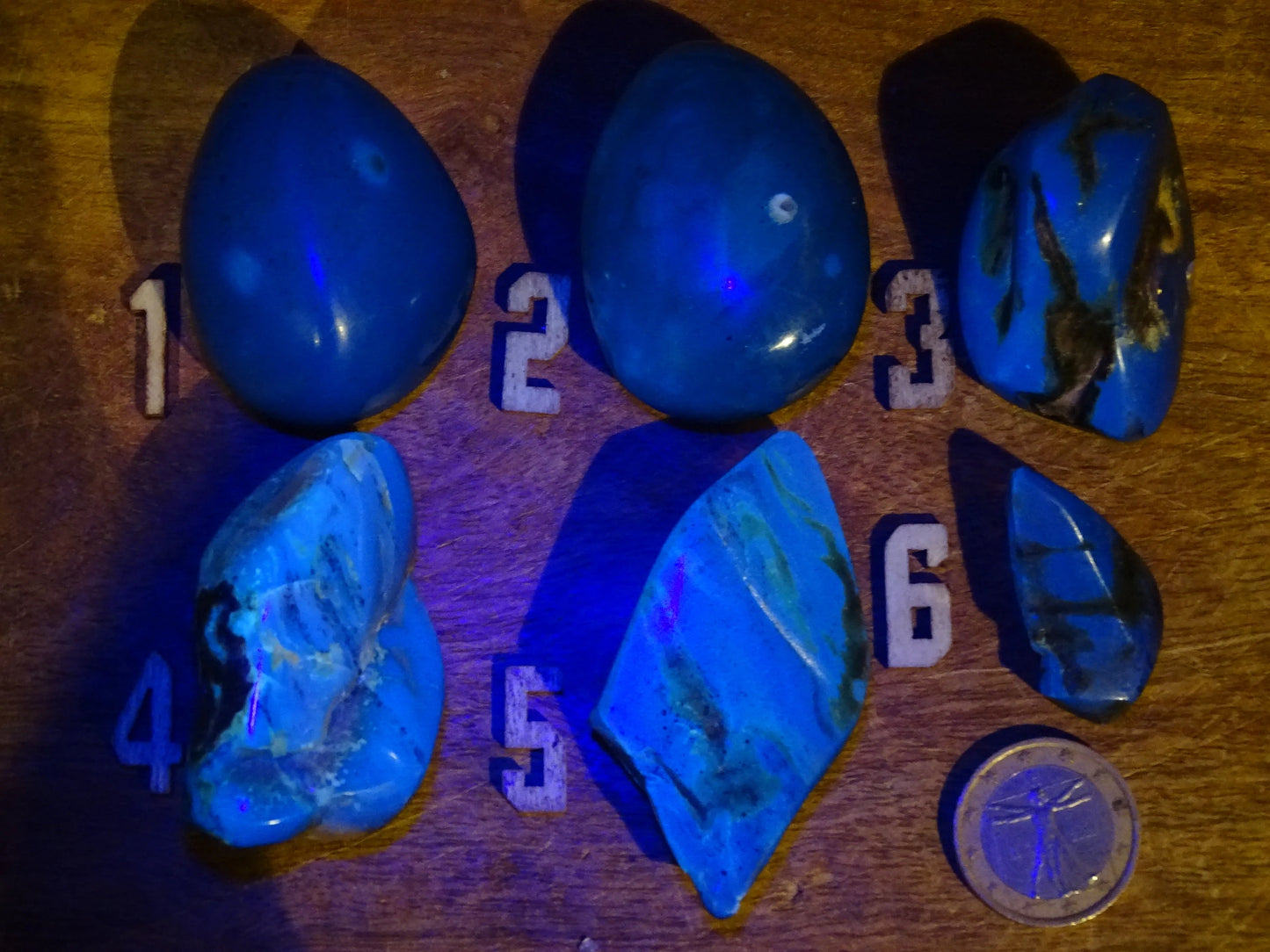 Sumatran blue amber, a selection of polished pebbles, 'cherry/cognac amber' color. Very high quality, when transparent you will see incredible amber red reflections and a captivating blue under a UV lamp!