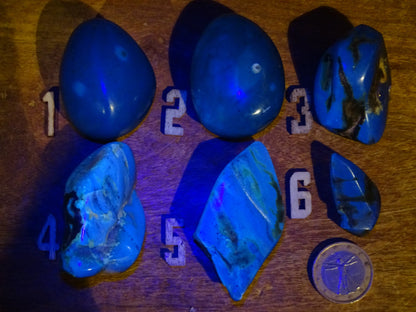 Sumatran blue amber, a selection of polished pebbles, 'cherry/cognac amber' color. Very high quality, when transparent you will see incredible amber red reflections and a captivating blue under a UV lamp!