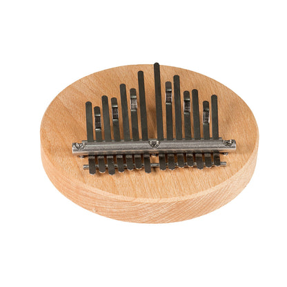 14-note Kalimba from Hands on Drum tuned*, with or without integrated magnet (for attachment to a cajon or drum). •Ø 14 centimeters, hardwood base 2 cm high. Dimensions: 14.00 × 14.00 × 5.00 cm
