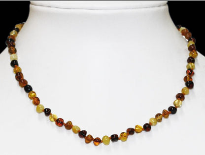Amber with a 'brilliant' finish, 5/7 millimeter free-form beads, sold in a 44-centimeter necklace. 'Amber screw' clasp system. AA to AAA quality, superb beads, lightweight and incredibly soft!
