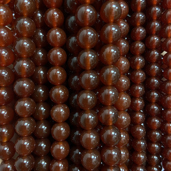 Cornaline, perles rondes de 6 ou 8 mm. Vendu en fil de perle 38/39 cm, en bracelet de 17 à 21cm, en collier de 45 ou sautoir de 60cm. Qualité AA à AAA !