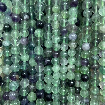 Fluorite, perles rondes de 4, 6 ou 8 mm. Vendu en fil de perle 38/39 cm, en bracelet de 17 à 21cm, en collier de 45 ou sautoir de 60cm. Qualité AA à AAA !