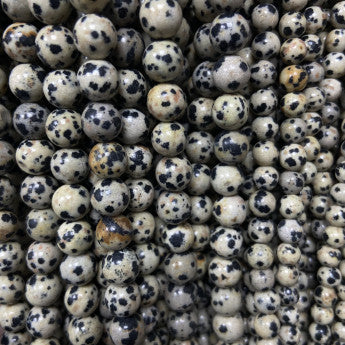 Jaspe dalmatien - Perles rondes de 4, 6, 8 ou 10 mm. Vendu en fil de perle 38/39 cm, en bracelet de 17 à 21cm, en collier de 45 ou sautoir de 60cm. Qualité AA à AAA !